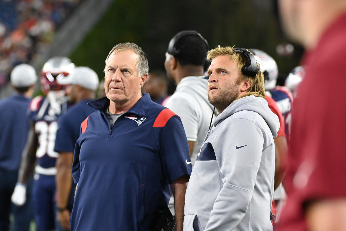 Aug 19, 2022; Foxborough, Massachusetts, USA; New England Patriots head coach Bill Belichick (left) and Steve Belichick, linebackers coach (right) watch the in stadium displays during the first half of a preseason against the Carolina Panthers game at Gillette Stadium. 